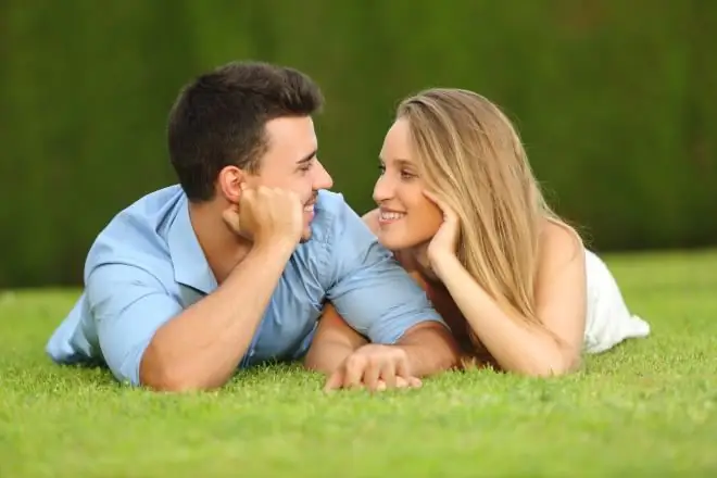 boy and girl lying on the lawn