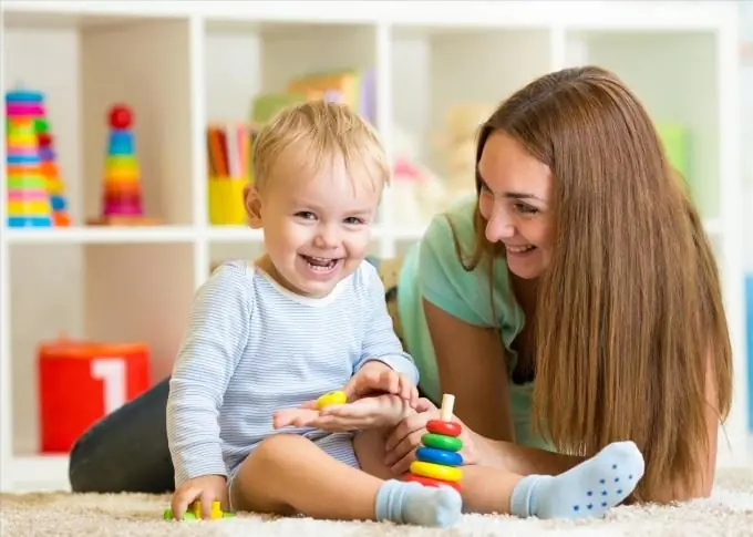 kid playing with a pyramid