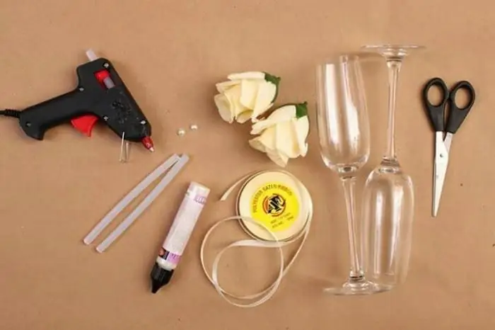 Glue gun, flowers, ribbons, glasses